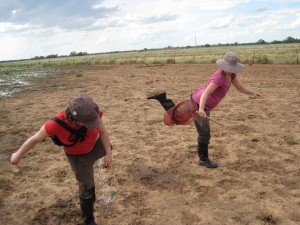 Emptying gumboots of water.